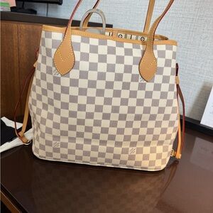Checkered bag only used twice. Getting a different design.